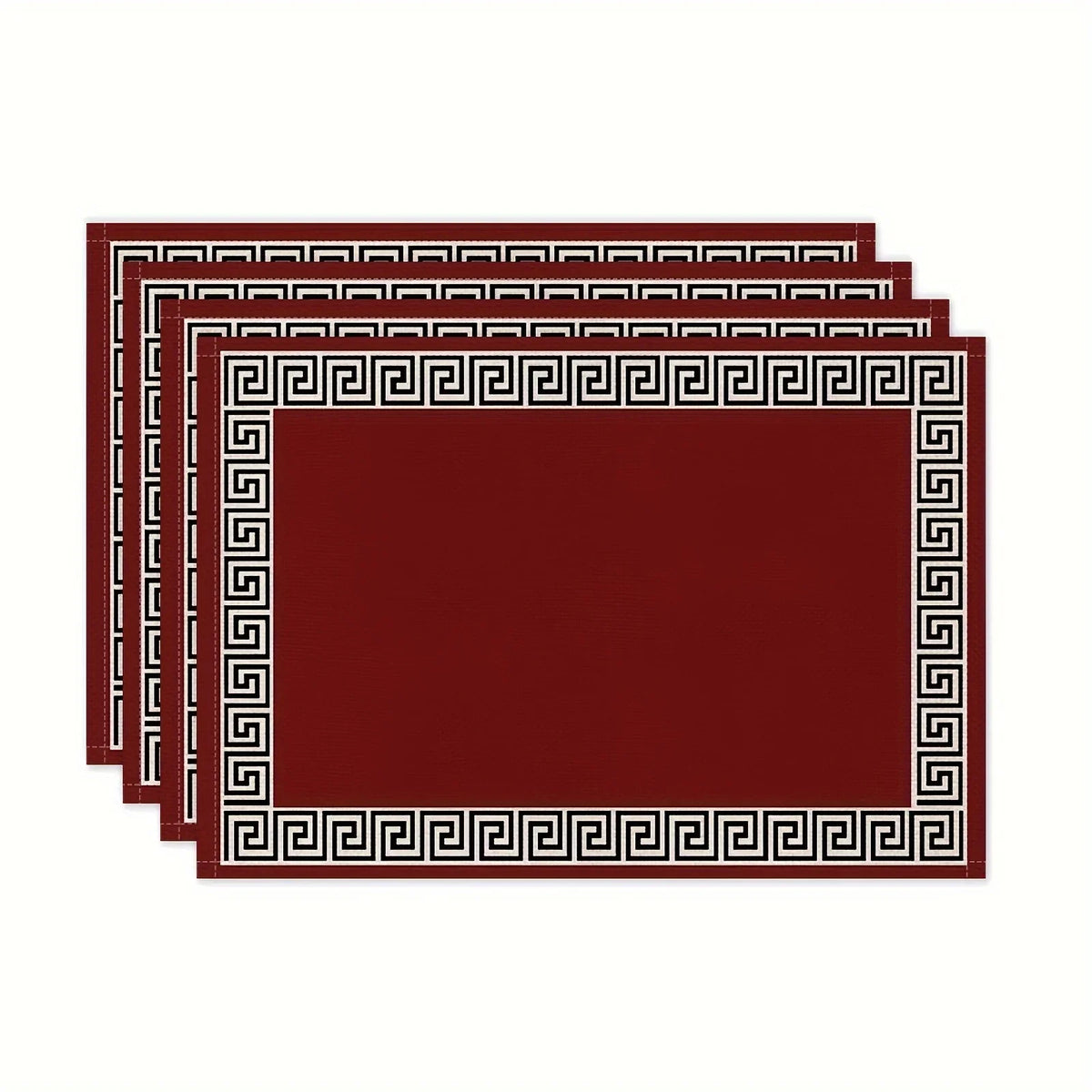 A set of solid maroon linen blend table placemats with intricate Greek key borders.