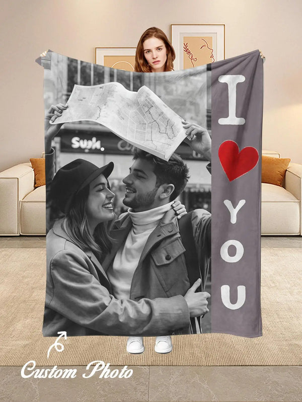 A custom photo personalized flannel blanket featuring a couple smiling and holding a map.