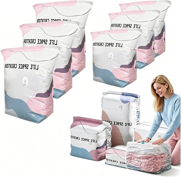 Multiple pink and white space-saving vacuum storage bags are displayed, some filled with fabric.