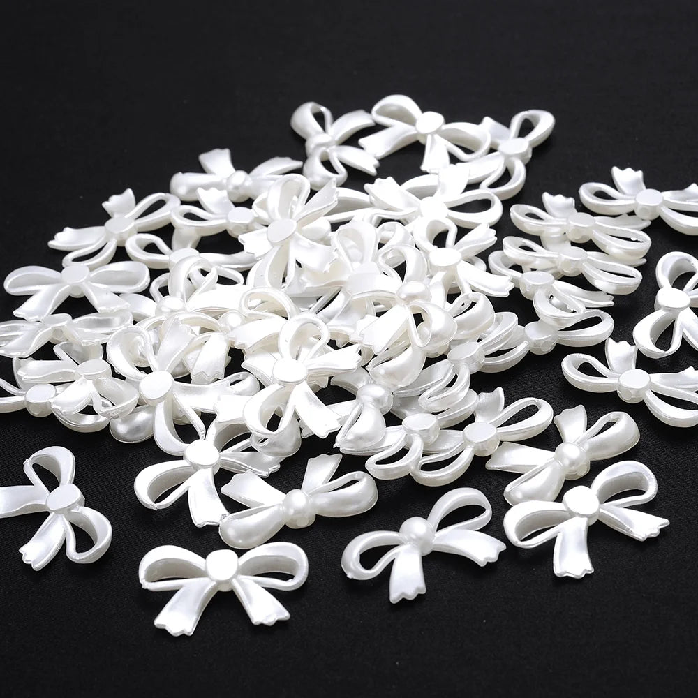 A pile of white imitation pearl flower spacer beads for DIY jewelry