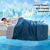 A blue quilted blanket is shown draped over a person sleeping, emphasizing its skin-friendly and breathable qualities for hot