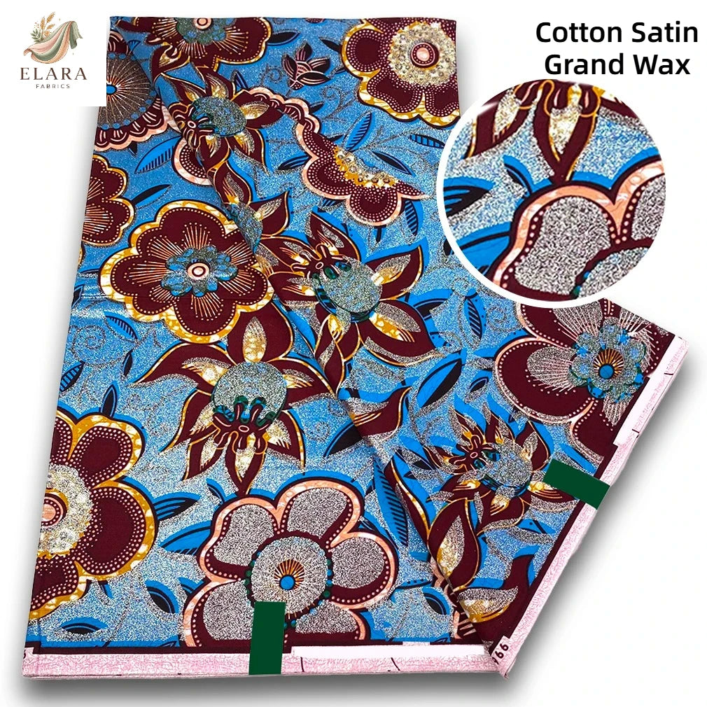 Cotton Satin Grand Wax fabric featuring intricate floral patterns in blue, brown, and gold tones.