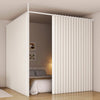 A white heavy duty foldable room divider curtain is shown in an open doorway, covering a bed area.