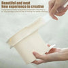 Hands hold a clear plastic sheet corner tightener clip used to fix bed sheets.