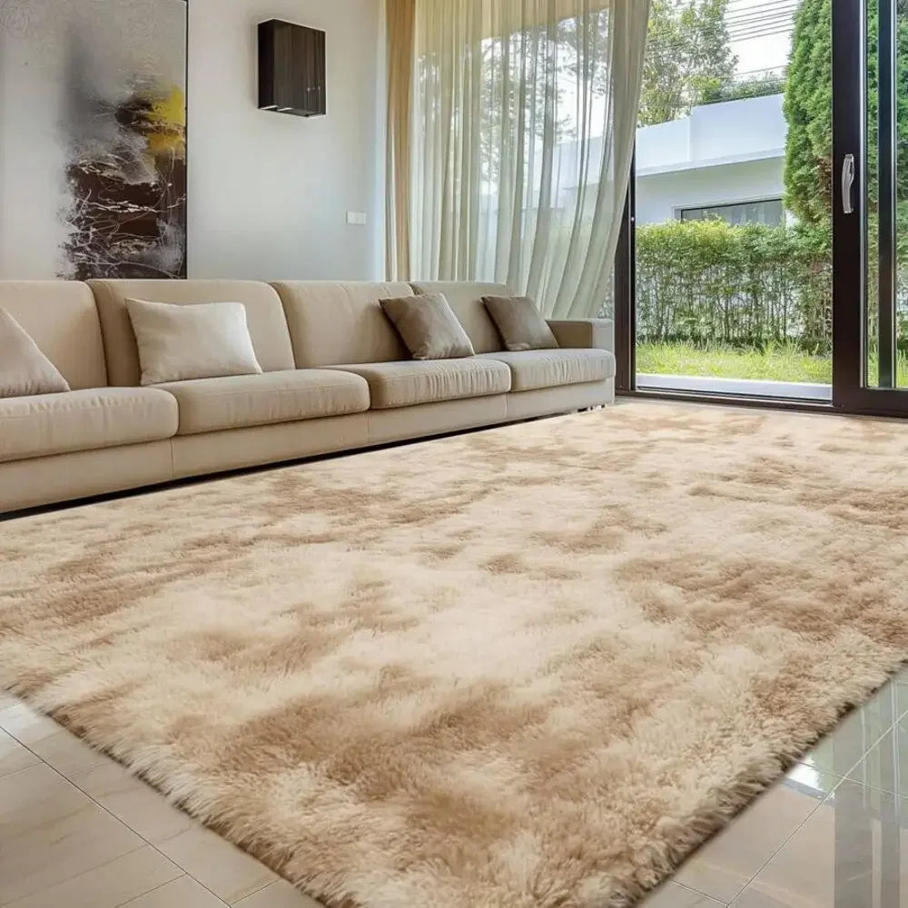 A plush beige bedroom carpet with a fluffy texture is displayed indoors next to a window.