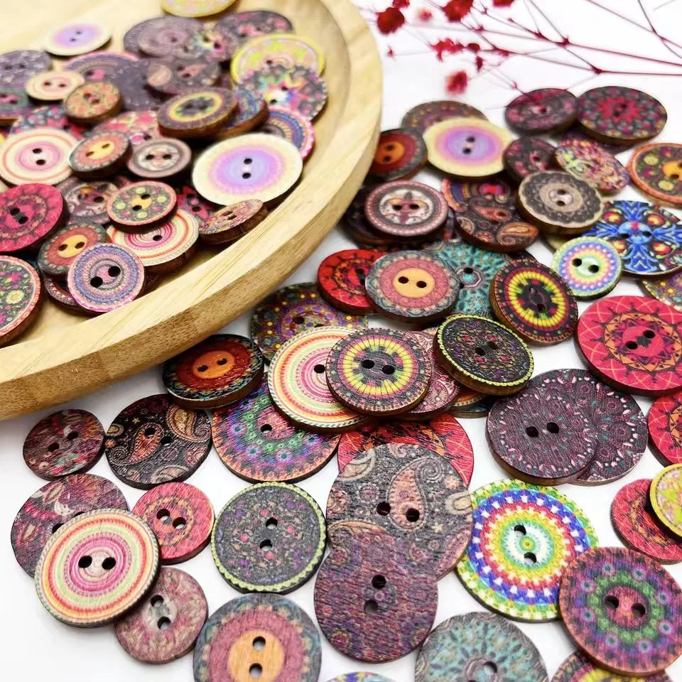 A collection of colorful, vintage-style wooden buttons in various shades and patterns.