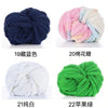 A collection of chunky chenille yarn balls in various colors including navy blue, pink, white, and green.