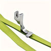 A silver industrial steel presser foot with an invisible zipper is shown attached to a lime green fabric strap.
