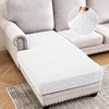 A white stretch cushion cover is placed on a light gray sofa, with a close-up showing the woven pattern.