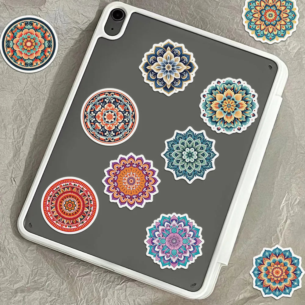 A gray phone case featuring several colorful mandala graffiti stickers.