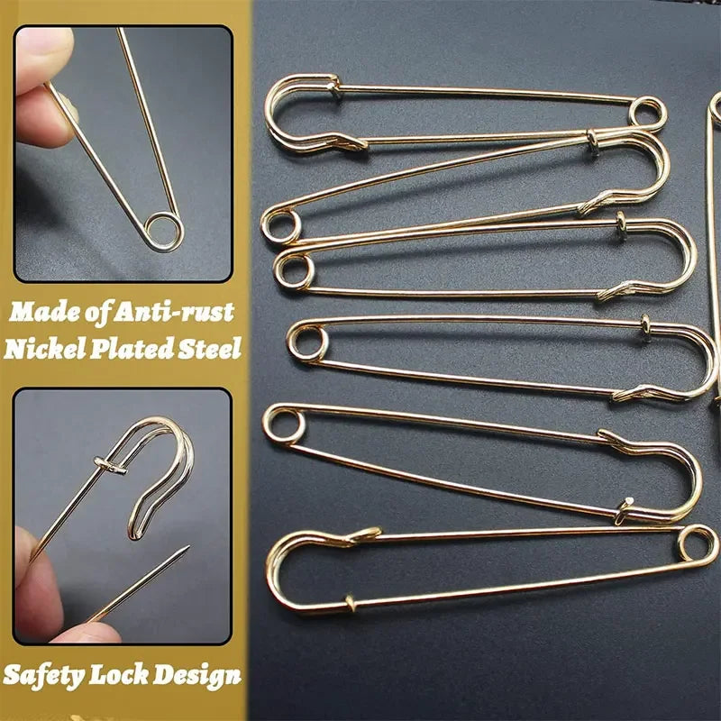 A collection of gold-colored anti-rust nickel-plated steel safety pins with a safety lock design.