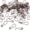 A pile of dark brown safety bulb pins for knitting and sewing
