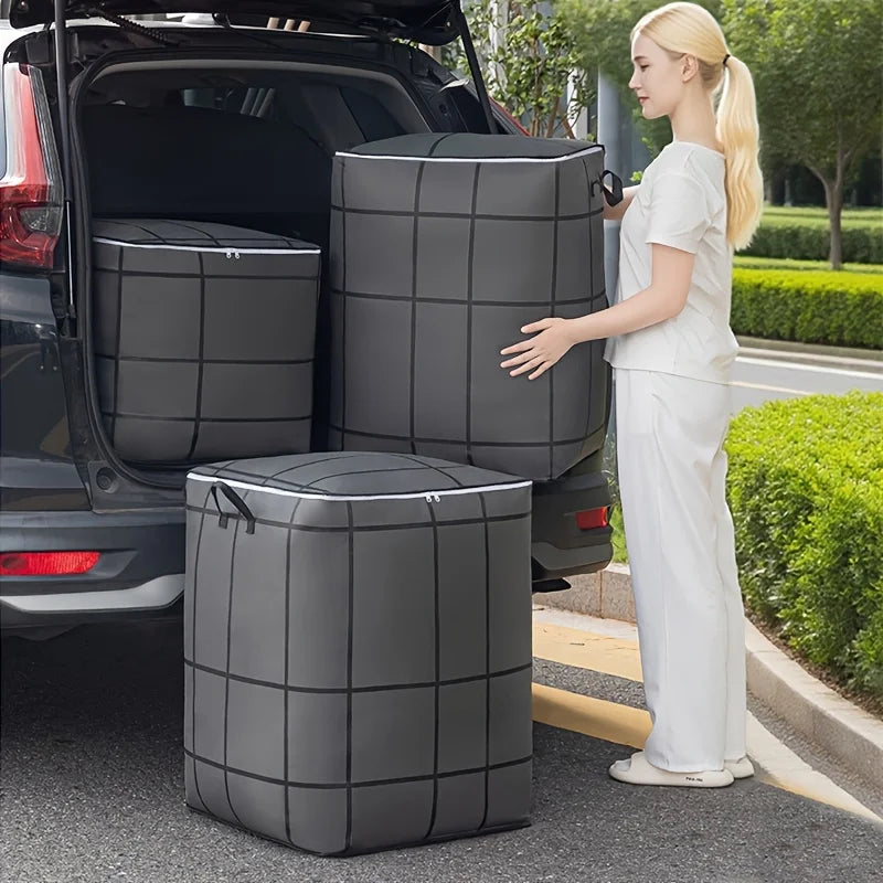 A woman stands next to a black fabric storage bag in the trunk of a car, showing the product.
