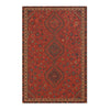 A detailed area rug featuring a deep red and brown Bohemian Turkish style pattern with geometric motifs.