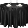 Black satin round table cloth set with glassware and napkins for elegant decor