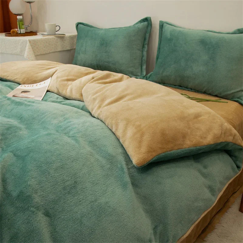 A teal flannel duvet cover set with tan accent pillows and a matching throw on a bed.