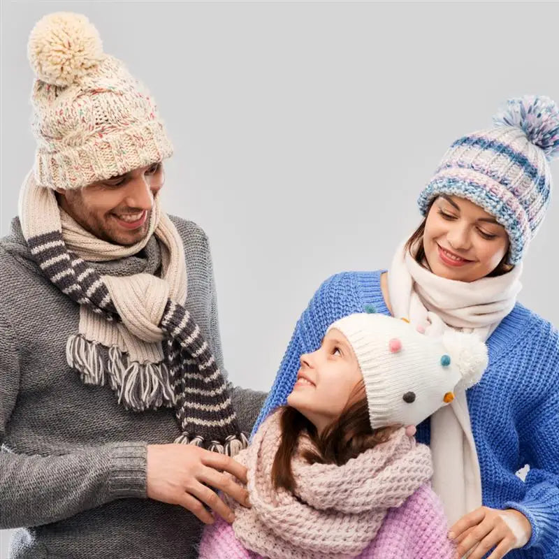 A woman is knitting a child with soft milk cotton yarn in a cozy, indoor setting.