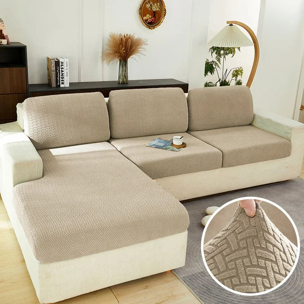 A beige durable sofa seat protector cushion cover shown on a light-colored sofa.