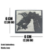 A dark gray embroidered tactical patch featuring a dragon design with hook and loop backing.
