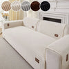 A beige minimalist anti-slip sofa cushion with ribbed fabric and decorative accent circles.