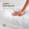A hand rests on a white cushion, demonstrating the comfy supportive feel of a breathable square core cushion.