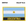 Embroidered patch of the flag of Argentina featuring horizontal blue and white stripes and a golden sun emblem.