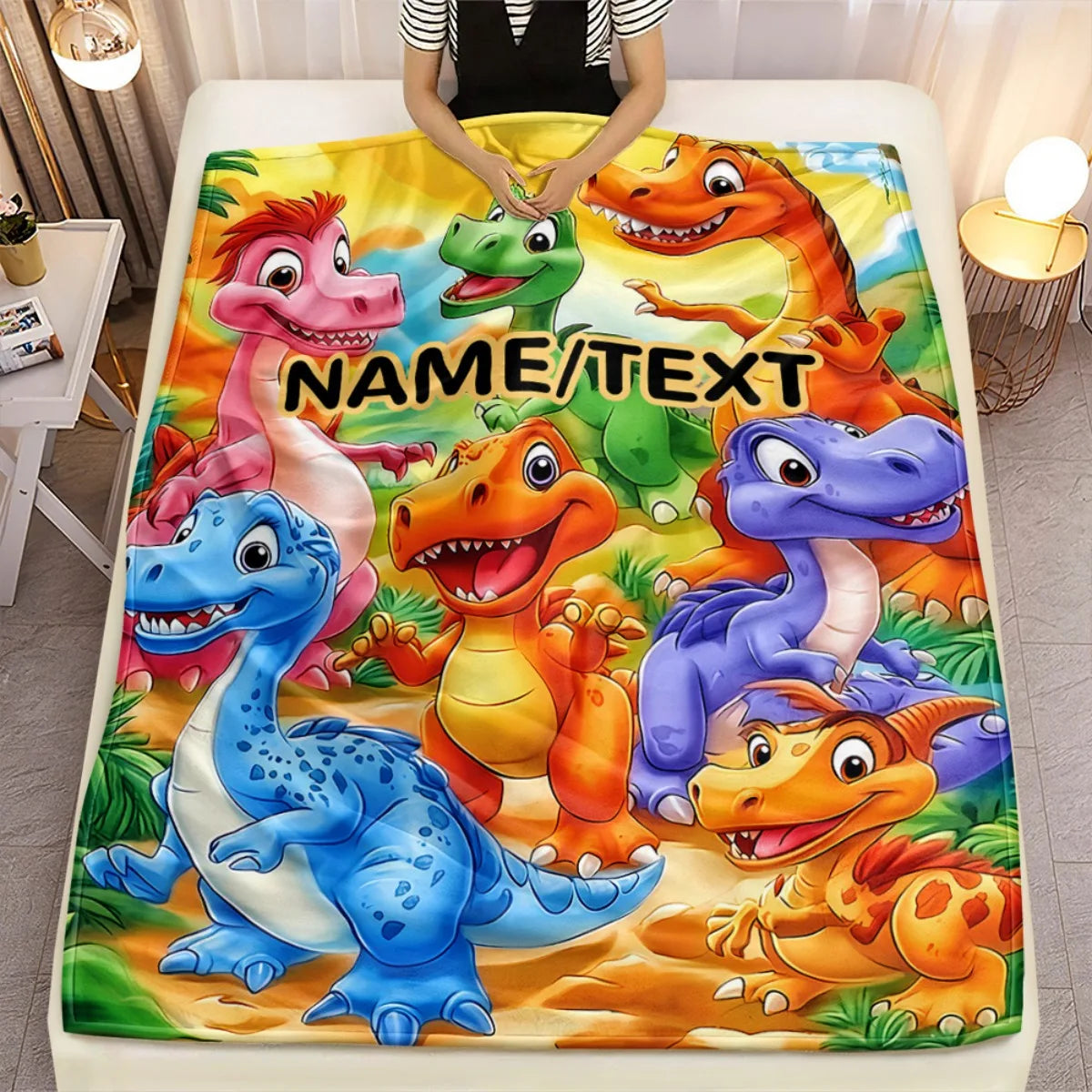 A colorful blanket featuring various cartoon dinosaurs for a personalized gift.