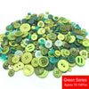 A pile of assorted resin sewing buttons in various shades of green and yellow.