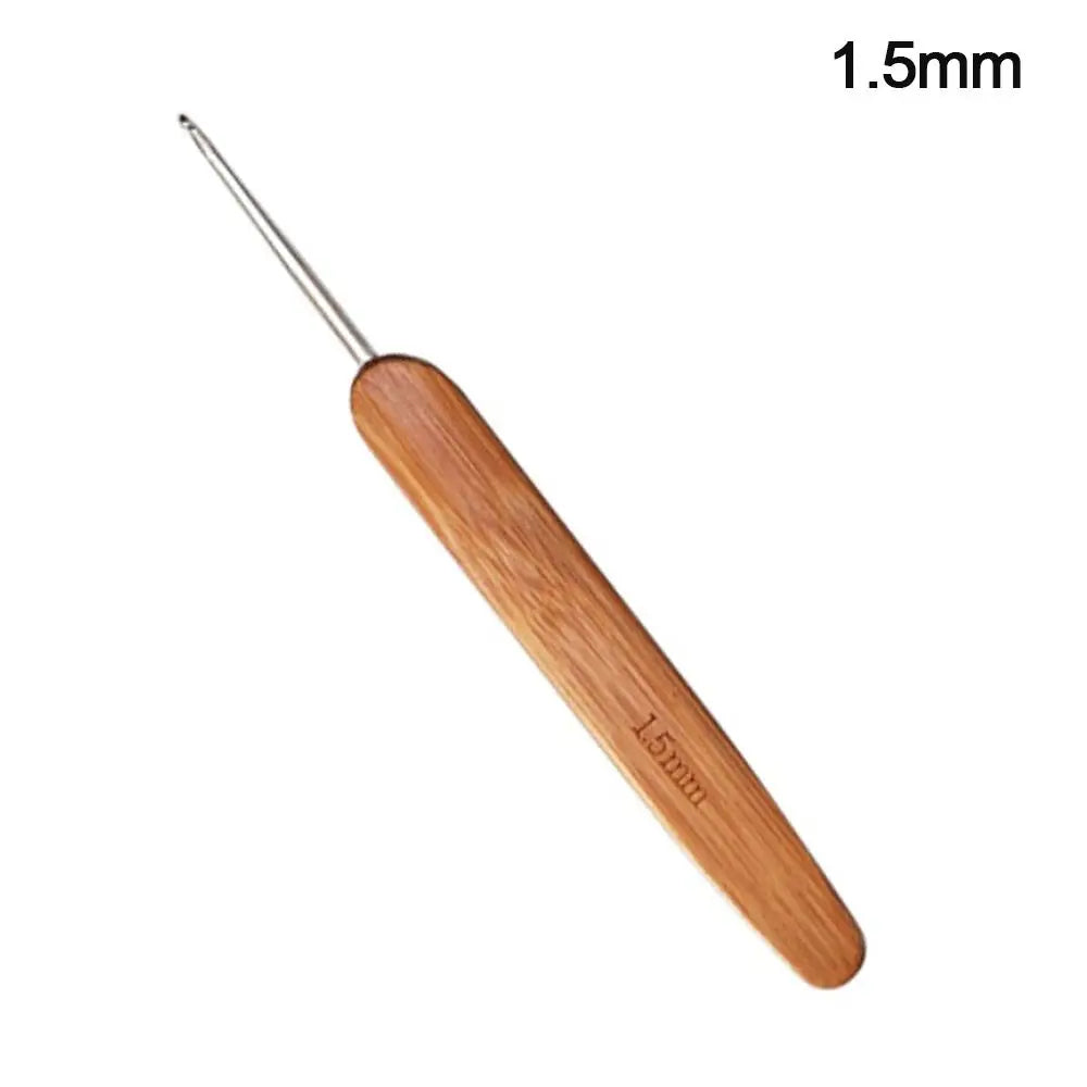 A wooden crochet and knitting needle with a 1.5mm tip and a bamboo handle.