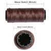 A roll of dark brown multi-color sewing thread with a visible core.