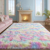A plush long-pile area rug with multicolored fluffy fibers in pink, blue, and yellow laid out on a wooden floor.