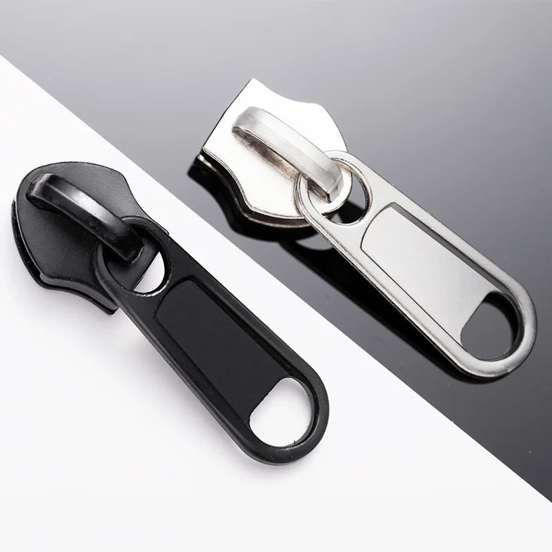 Silver and black universal zipper repair kit with replacement sliders shown on a white background.