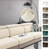 A beige jacquard knit sofa cushion cover displayed on a light gray sofa with a modern floor lamp.