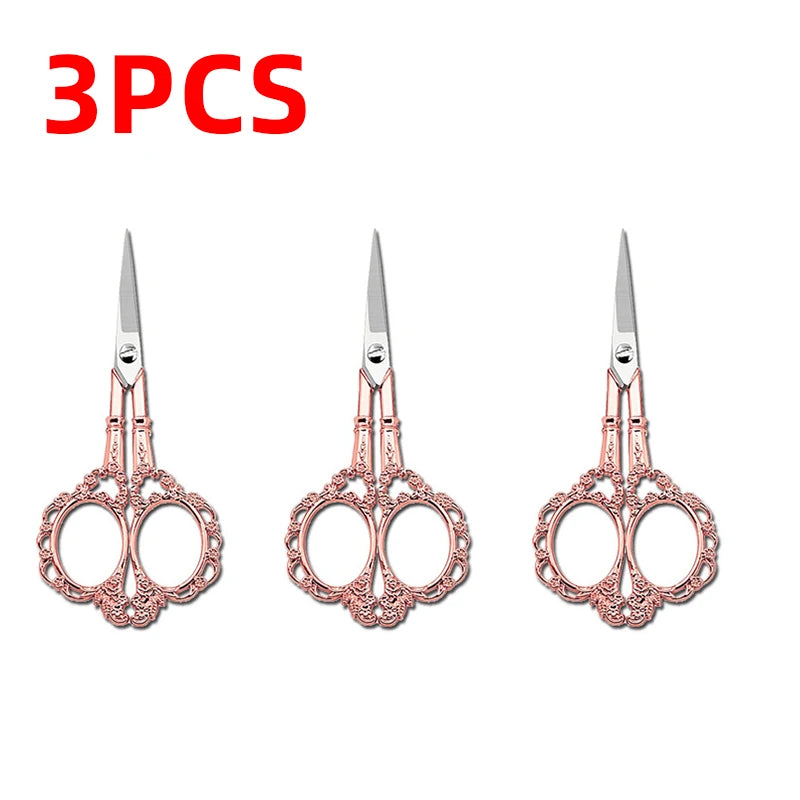 Three pairs of rose gold colored crafting scissors with decorative handles