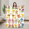 A colorful strawberry shortcake plush throw blanket featuring various sweet characters and fruit designs.