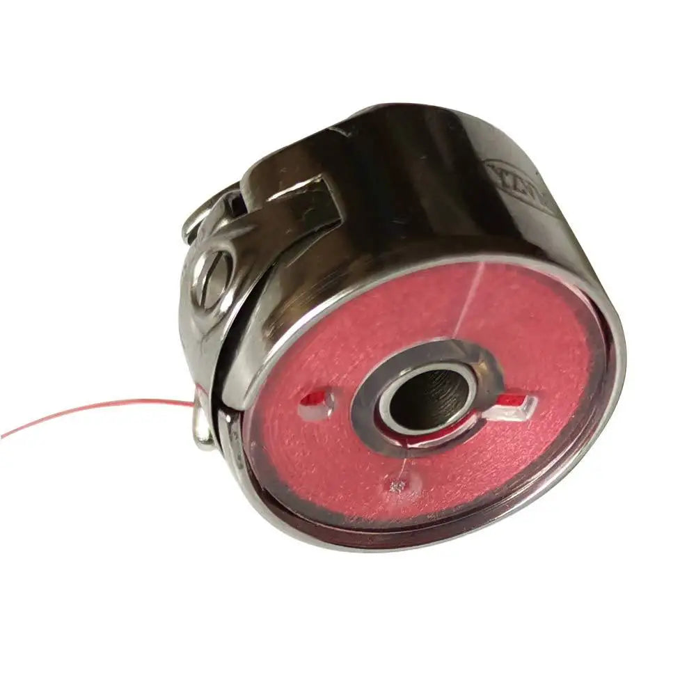 A close-up view of a prewound sewing machine bobbin thread on a metal spool.