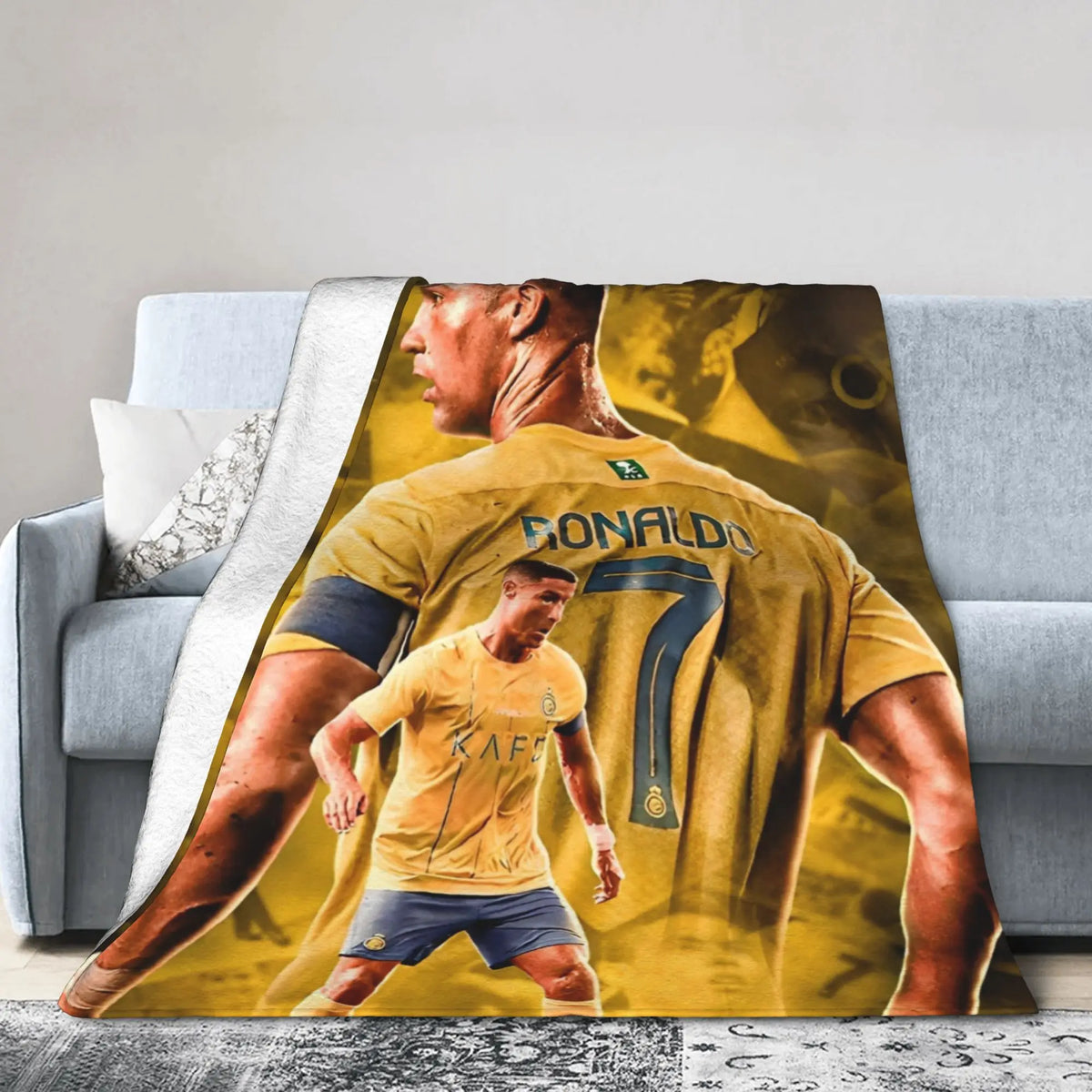 A yellow football jersey featuring a player and the name GONALDO is printed on a throw blanket.