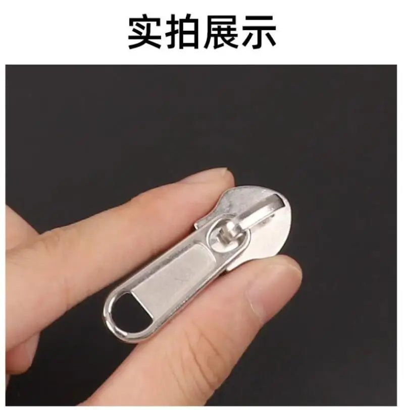 A hand holds a silver universal zipper repair kit with replacement sliders, showing the product display.