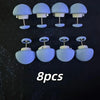 Eight light blue no-sew silicone quilt clips arranged in a row.