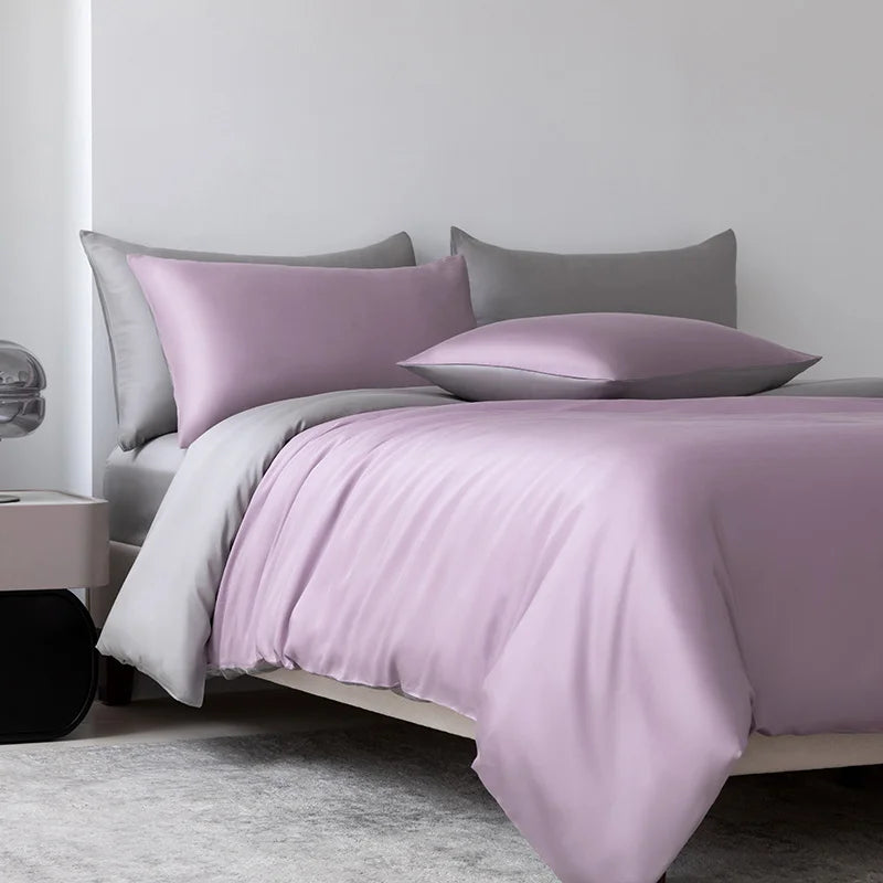 A luxury bamboo duvet cover set featuring soft lavender and gray tones on a bed.