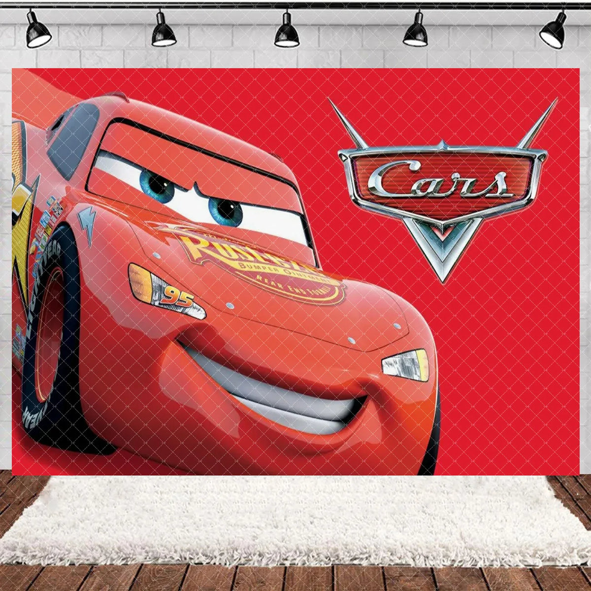 A close-up of a red cartoon race car, Lightning McQueen, against a red diamond pattern backdrop.