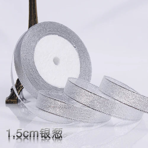 Roll of silver glitter organza ribbon for gift wrapping and DIY crafts