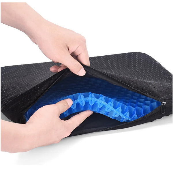 A hand opens an ergonomic cooling seat cushion to reveal a blue, textured interior.