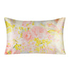 A square silk pillowcase featuring a soft pink and yellow floral print.