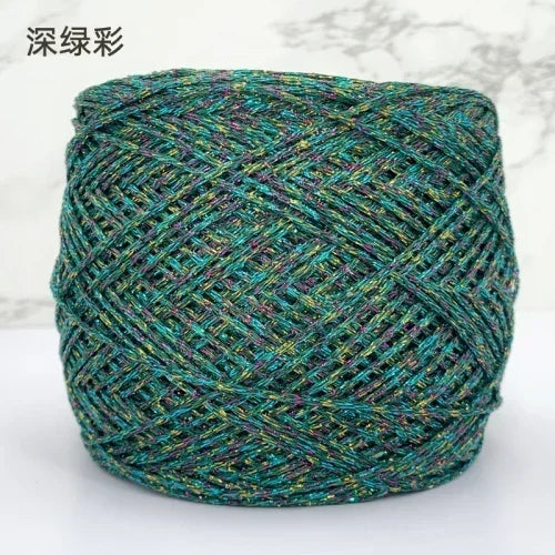 A ball of metallic silk crocheting and knitting yarn with a multicolored, textured appearance.