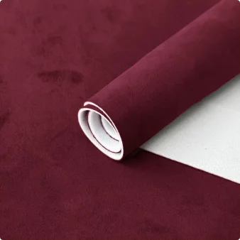 Roll of deep burgundy suede auto headliner fabric with foam backing