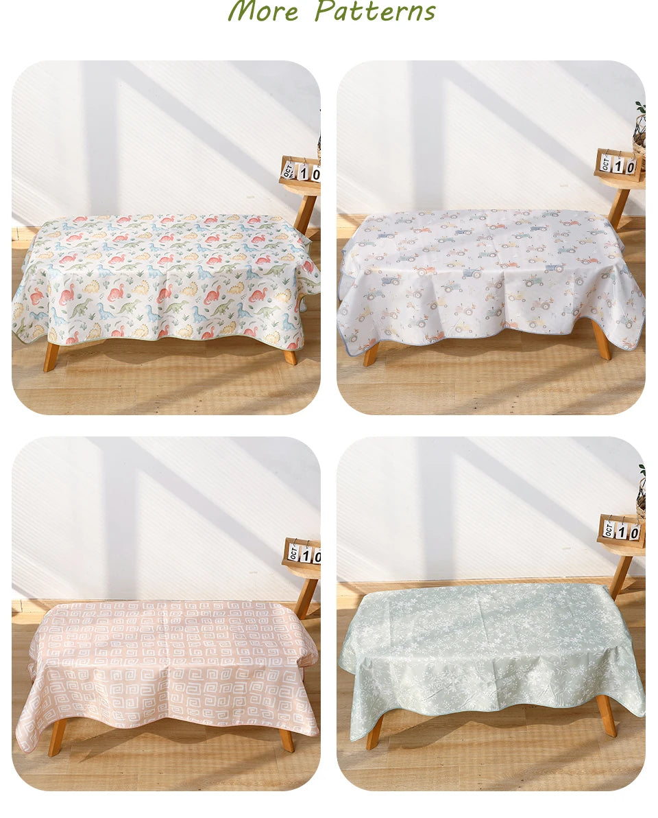 Four patterns of waterproof baby play mats with anti-slip backing displayed on a wooden surface.