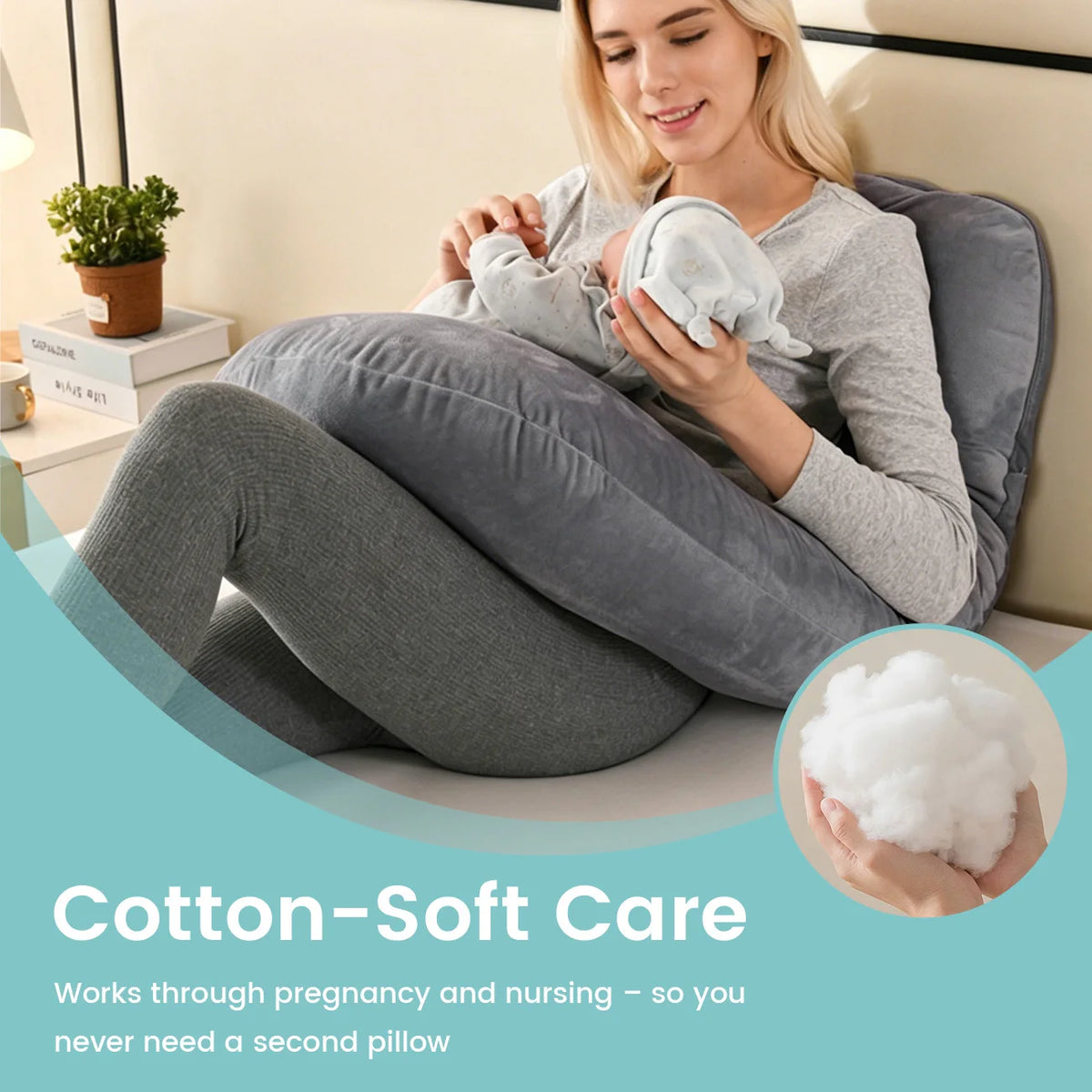 A woman is using a soft, gray ergonomic J-shaped maternity pillow while sitting down.