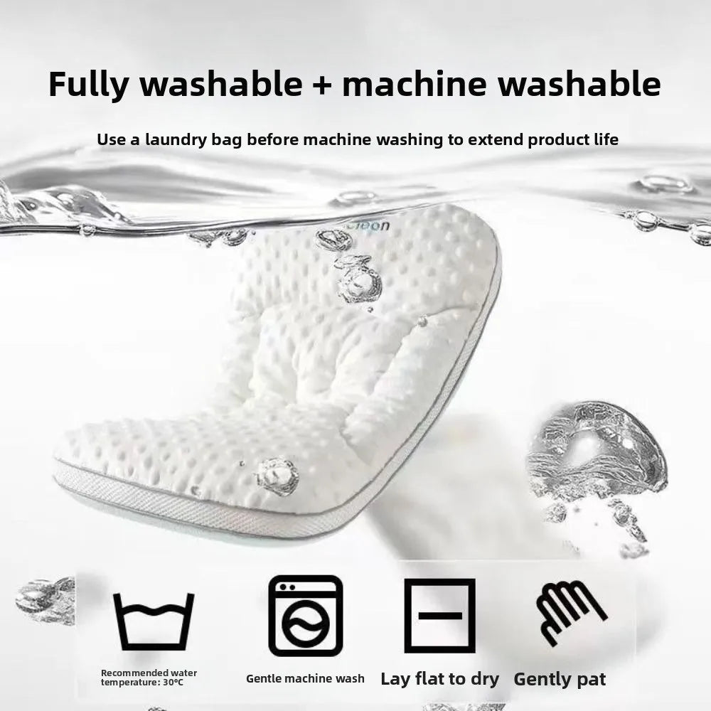 A white breathable newborn sleep pillow shown with laundry instructions and washing symbols.