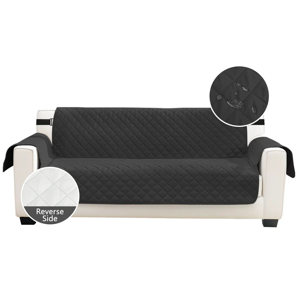 A black quilted sofa slipcover with a light beige frame and a circular detail showing the reverse side.